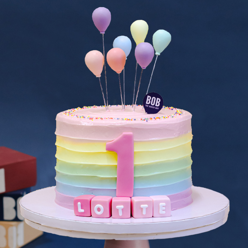 Pastel Rainbow Swirls with Balloons and Name Cubes